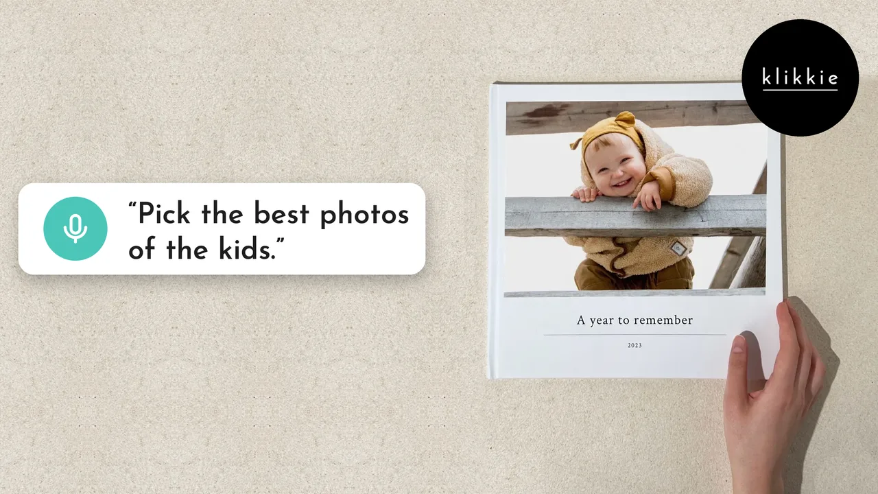 A hand holding a klikkie Large photo book with a laughing baby and “A year to remember” on the cover, with the words “Pick the best photos of the kids.”
